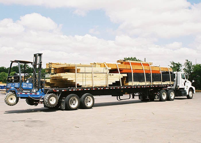 delivery truck loaded with lumber