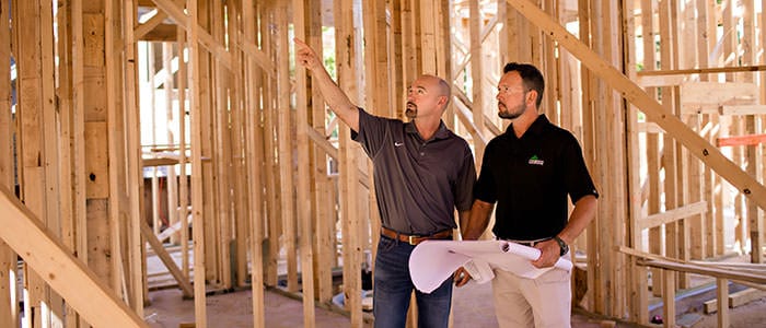 Sales Rep with Builder in Framed Interior
